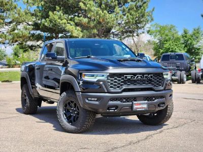 2026 RAM 1500 RAM 1500 RHO CREW CAB 4X4 5'7' BOX in Diamond Black Crystal Pearl-Coat Exterior Paint — front three-quarter view