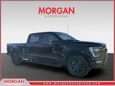 2023 Ford F-150 Lariat in Black — front three-quarter view