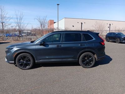 2023 Honda CR-V Hybrid Sport Touring — rear three-quarter view