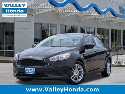 2018 Ford Focus SE in Shadow Black — front three-quarter view