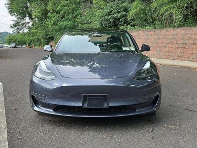 2023 Tesla Model 3 — side profile view