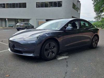 2023 Tesla Model 3 — rear three-quarter view