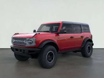 2025 Ford Bronco Badlands in Ruby Red Metallic Tinted Clearcoat — front three-quarter view