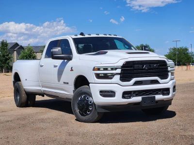 2026 RAM 3500 RAM 3500 LARAMIE CREW CAB 4X4 8' BOX in Bright White Clear-Coat Exterior Paint — front three-quarter view