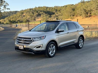 2017 Ford Edge in Gold — front three-quarter view