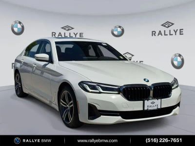 2023 BMW 5 Series 530i xDrive in Alpine White — front three-quarter view