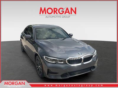 2021 BMW 3 Series 330e xDrive in Mineral Gray Metallic — front three-quarter view