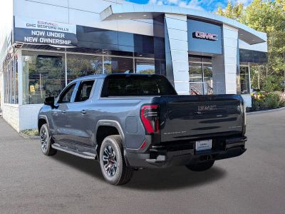 2026 GMC Sierra EV — rear three-quarter view