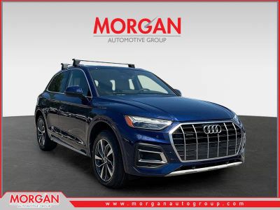 2021 Audi Q5 Premium in Navarra Blue Metallic — front three-quarter view