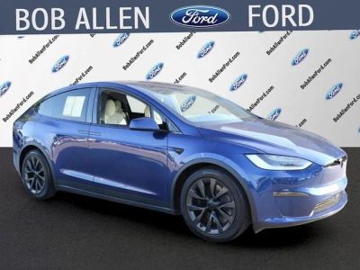 2023 Tesla Model X Base in Deep Blue Metallic — front three-quarter view