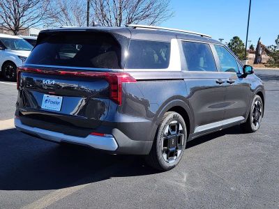 2026 Kia Carnival — rear three-quarter view