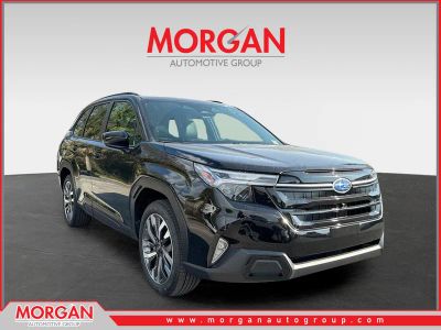 2026 Subaru Forester Touring in Crystal Black Silica — front three-quarter view