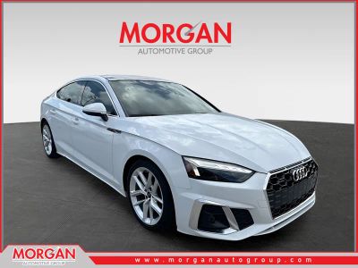 2023 Audi A5 Sportback S line Premium Plus in Ibis White — front three-quarter view