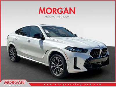 2026 BMW X6 M60i in White Metallic — front three-quarter view