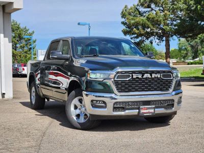 2026 RAM 1500 RAM 1500 BIG HORN CREW CAB 4X4 5'7' BOX in Serrano-Green Metallic Exterior Paint — front three-quarter view