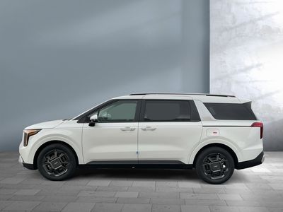 2026 Kia Carnival Hybrid — rear three-quarter view