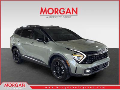 2023 Kia Sportage X-Pro Prestige in Green — front three-quarter view