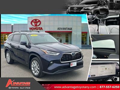 2023 Toyota Highlander Hybrid Limited in Blue — front three-quarter view