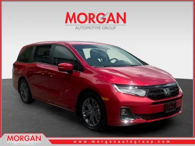 2026 Honda Odyssey Touring in Red — front three-quarter view