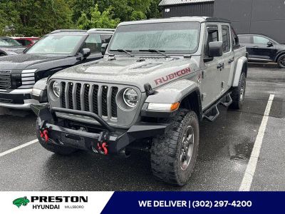 2022 Jeep Gladiator Rubicon in Sting-Gray Clearcoat — front three-quarter view