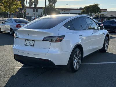 2023 Tesla Model Y — rear three-quarter view