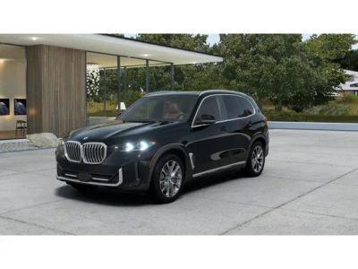 2026 BMW X5 xDrive50e in Black Sapphire Metallic — front three-quarter view
