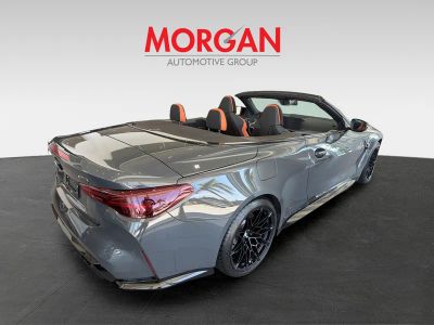 2025 BMW M4 — rear three-quarter view