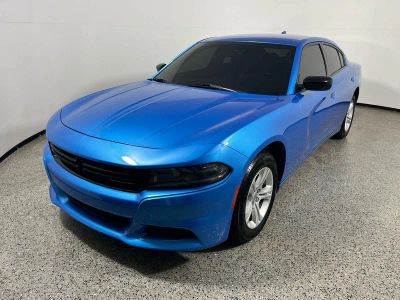 2023 Dodge Charger SXT in B5 Blue Pearlcoat — front three-quarter view
