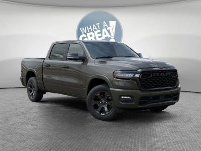 2026 RAM 1500 Big Horn in Tank Exterior Paint — front three-quarter view