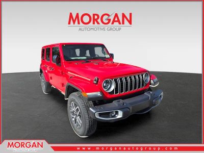2025 Jeep Wrangler Sahara in Firecracker Red Clearcoat — front three-quarter view