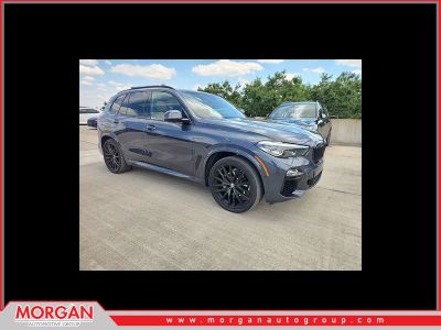 2021 BMW X5 sDrive40i in Arctic Gray Metallic — front three-quarter view
