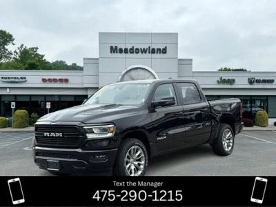 2023 RAM 1500 Laramie in Diamond Black Crystal Pearlcoat — front three-quarter view