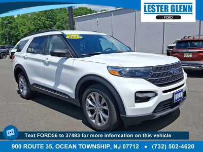 2023 Ford Explorer XLT in Star White Metallic Tri-Coat — front three-quarter view