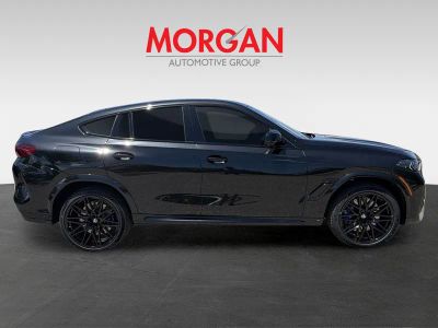 2027 BMW X6 M — rear three-quarter view