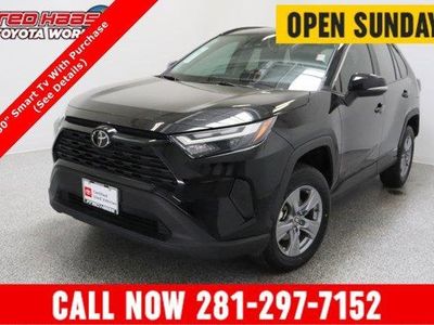2025 Toyota RAV4 AWD Hybrid XLE 2.5L in Midnight Black Metallic — front three-quarter view