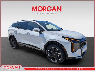 2026 Kia Sportage Hybrid SX-Prestige in Snow White Pearl — front three-quarter view