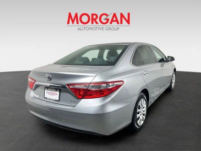2015 Toyota Camry — rear three-quarter view