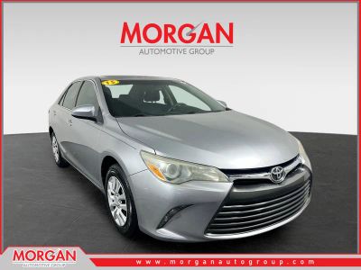 2015 Toyota Camry LE in Celestial Silver Metallic — front three-quarter view