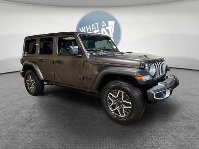 2026 Jeep Wrangler Sahara in Granite Crystal Metallic Clear-Coat Exterior Paint — front three-quarter view