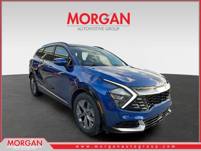 2023 Kia Sportage SX in Sapphire Blue — front three-quarter view