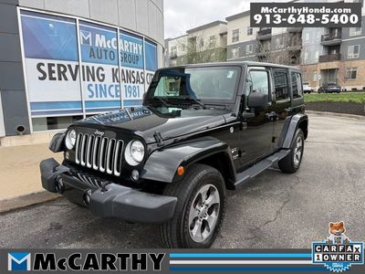2016 Jeep Wrangler JKJP74 — front three-quarter view