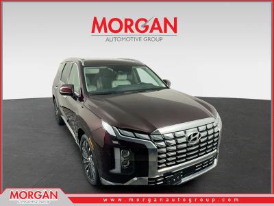 2024 Hyundai Palisade Calligraphy in Sierra Burgundy — front three-quarter view