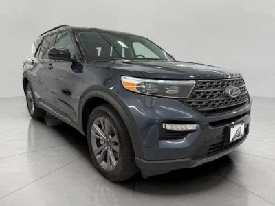 2024 Ford Explorer XLT 4WD in Stone Blue Metallic — front three-quarter view