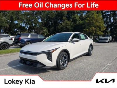 2026 Kia K4 LXS in Snow White Pearl — front three-quarter view