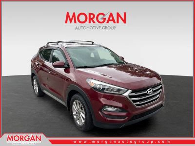 2017 Hyundai Tucson SE in Ruby Wine — front three-quarter view