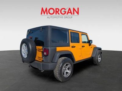 2013 Jeep Wrangler — rear three-quarter view