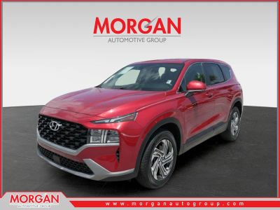 2023 Hyundai Santa Fe SE in Calypso Red — front three-quarter view