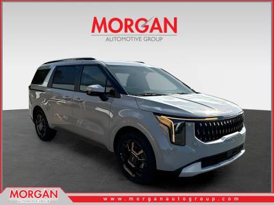 2026 Kia Carnival Hybrid EX in Silver — front three-quarter view