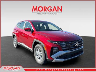 2026 Hyundai TUCSON SE in Ultimate Red — front three-quarter view