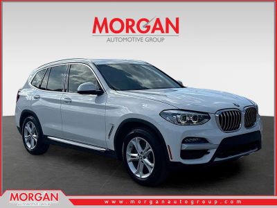 2020 BMW X3 sDrive30i in Alpine White — front three-quarter view